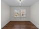 Bright bedroom with hardwood floors and large windows at 3319 Holt St, Charlotte, NC 28205