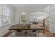 Bright dining room features a large wooden table and access to the kitchen and living areas at 3319 Holt St, Charlotte, NC 28205