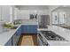 Modern kitchen with blue cabinets, white countertops, and stainless steel appliances at 3319 Holt St, Charlotte, NC 28205