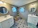 Double vanity bathroom with white cabinets and geometric tile floors at 334 Stanley Spencer Mtn Rd, Gastonia, NC 28056