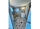 Bathroom featuring a white vanity, geometric tile floor, and decorative shelving at 334 Stanley Spencer Mtn Rd, Gastonia, NC 28056