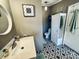 Updated bathroom with modern vanity and stylish geometric tile floor at 334 Stanley Spencer Mtn Rd, Gastonia, NC 28056