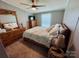 Bedroom with a king-size bed, dresser, and ceiling fan at 334 Stanley Spencer Mtn Rd, Gastonia, NC 28056