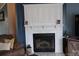 Cozy living room featuring a white fireplace with a built-in mantle at 334 Stanley Spencer Mtn Rd, Gastonia, NC 28056