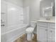 Bathroom with tub, toilet and white vanity at 368 Pleasant Hill Se Dr, Concord, NC 28025