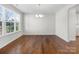 Spacious dining area with hardwood floors and large window at 368 Pleasant Hill Se Dr, Concord, NC 28025