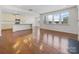 Open concept kitchen with island and hardwood floors at 368 Pleasant Hill Se Dr, Concord, NC 28025