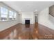 Spacious living room featuring hardwood floors and a fireplace at 368 Pleasant Hill Se Dr, Concord, NC 28025