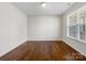 Well-lit spare bedroom with hardwood floors at 368 Pleasant Hill Se Dr, Concord, NC 28025