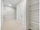 Spacious walk-in closet with wire shelving and double hanging rods at 368 Pleasant Hill Se Dr, Concord, NC 28025