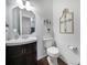 Modern bathroom with dark vanity, updated fixtures and flooring at 3812 Leela Palace Way, Fort Mill, SC 29708