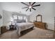 Main bedroom with ceiling fan, ample closet space and neutral decor at 3812 Leela Palace Way, Fort Mill, SC 29708