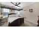 Comfortable bedroom with a ceiling fan and wood bed frame at 3812 Leela Palace Way, Fort Mill, SC 29708