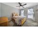 Bright bedroom featuring a ceiling fan and wood-framed bed at 3812 Leela Palace Way, Fort Mill, SC 29708