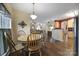 Charming dining area with wood table and chairs, hardwood floors at 3812 Leela Palace Way, Fort Mill, SC 29708