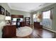 Home office with built-in desk, bookcases, and hardwood floors at 3812 Leela Palace Way, Fort Mill, SC 29708