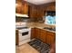 Simple kitchen with wood cabinets and white appliances at 503 Welsh Ave, Monroe, NC 28112