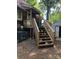 Wooden steps leading up to a cabin's deck at 503 Welsh Ave, Monroe, NC 28112