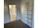 Bedroom with built-in shelving and view of kitchen at 518 W White St, Chester, SC 29706