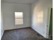 Bright bedroom featuring carpet and a window at 518 W White St, Chester, SC 29706