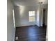 Spacious bedroom with dark laminate flooring at 518 W White St, Chester, SC 29706