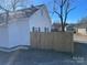 Side view of the house showcasing a wooden fence at 518 W White St, Chester, SC 29706