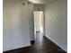 Hallway with dark flooring leading to exterior at 518 W White St, Chester, SC 29706