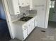 White kitchen with double sink and gray tile at 518 W White St, Chester, SC 29706