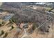 Aerial view showing house, lot lines, and pond at 5605 Miami Ln, Concord, NC 28025