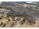 Aerial view of house, driveway, and pond at 5605 Miami Ln, Concord, NC 28025