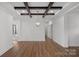 Bright dining room with hardwood floors and a modern chandelier at 5605 Miami Ln, Concord, NC 28025