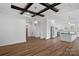 Spacious dining room with hardwood floors and exposed beams at 5605 Miami Ln, Concord, NC 28025