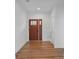 Bright and airy entryway with hardwood floors and a modern door at 5605 Miami Ln, Concord, NC 28025