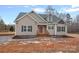 House exterior with stone walkway and green shutters at 5605 Miami Ln, Concord, NC 28025