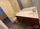 Clean bathroom with a vanity, toilet and bathtub at 5732 Prescott Ct, Charlotte, NC 28269