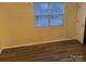 Spacious bedroom with large window and laminate floors at 5732 Prescott Ct, Charlotte, NC 28269