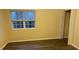 Bright bedroom with new flooring and a large window at 5732 Prescott Ct, Charlotte, NC 28269