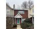 Brick front exterior of charming townhome with teal door at 5732 Prescott Ct, Charlotte, NC 28269