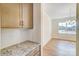 Kitchen features a butlers pantry with granite countertop and white subway tile backsplash at 5763 Crown Ter, Hickory, NC 28601