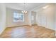 Spacious dining area with light walls, wood flooring, and a chandelier at 5763 Crown Ter, Hickory, NC 28601