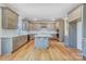 Modern kitchen with gray cabinets, granite island, and stainless steel appliances at 5763 Crown Ter, Hickory, NC 28601