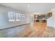 Open living space with kitchen views and wood flooring at 5763 Crown Ter, Hickory, NC 28601