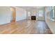 Living room with a fireplace, large windows, and sunroom access at 5763 Crown Ter, Hickory, NC 28601