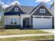 Gray and white two-story house with a two-car garage and landscaping at 5775 Crown Ter, Hickory, NC 28601