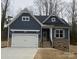 Dark blue and light brown two-story house with a two-car garage at 5775 Crown Ter, Hickory, NC 28601