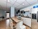 Basement kitchenette with white cabinets and stainless steel appliances at 585 Ambergate Nw Pl, Concord, NC 28027