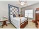 Cozy bedroom with wooden bed frame and decorative quilt at 585 Ambergate Nw Pl, Concord, NC 28027