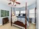 Lovely bedroom with four-poster bed and corner windows at 585 Ambergate Nw Pl, Concord, NC 28027