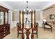 Formal dining room with large windows and a chandelier at 585 Ambergate Nw Pl, Concord, NC 28027