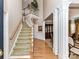 Two-story foyer with hardwood floors and elegant staircase at 585 Ambergate Nw Pl, Concord, NC 28027